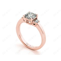 Radiant square cut three stone diamond ring claw set centre stone in 18K Rose