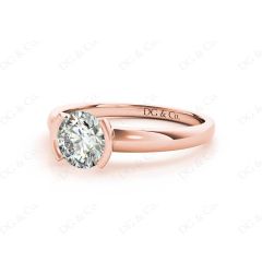 Round Cut Bezel Set Diamond Ring on a Plain Band. in 18K Rose
