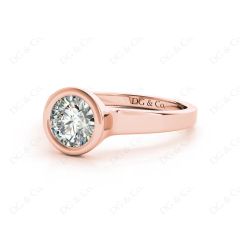 Round Cut Bezel Set Solitaire Engagement Ring With a Plain Band in 18K Rose