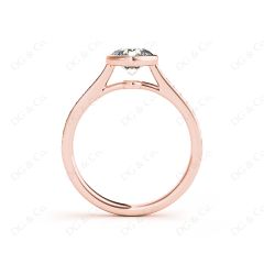 Round Cut Bezel Diamond Ring with Channel Set Side Stones in 18K Rose