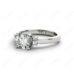 Radiant square cut three stone diamond ring claw set centre stone in Platinum