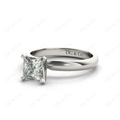 Princess Cut Classic Four Claw Diamond Solitaire Ring with Half Round Edge Shoulders in Platinum