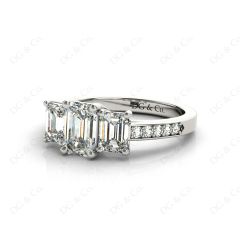 Emerald Cut Trilogy Ring with Channel Set Shoulder Diamonds in Platinum