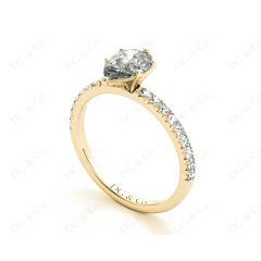 Marquise Cut Claw Set Diamond ring with pave set side stone in 18K Yellow