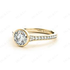 Round Cut Bezel Set Diamond Ring with Channel Set Diamonds Down the Shoulders in 18K Yellow