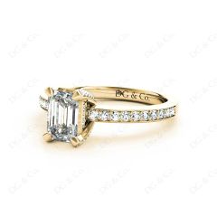 Emerald Cut Four Claw Diamond Ring with grain set side stones in 18K Yellow