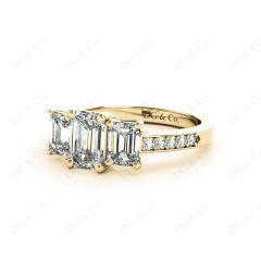 Emerald Cut Trilogy Ring with Channel Set Shoulder Diamonds in 18K Yellow