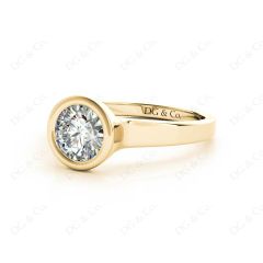 Round Cut Bezel Set Solitaire Engagement Ring With a Plain Band in 18K Yellow