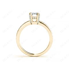 Emerald Cut Four Claw Diamond Ring with grain set side stones in 18K Yellow